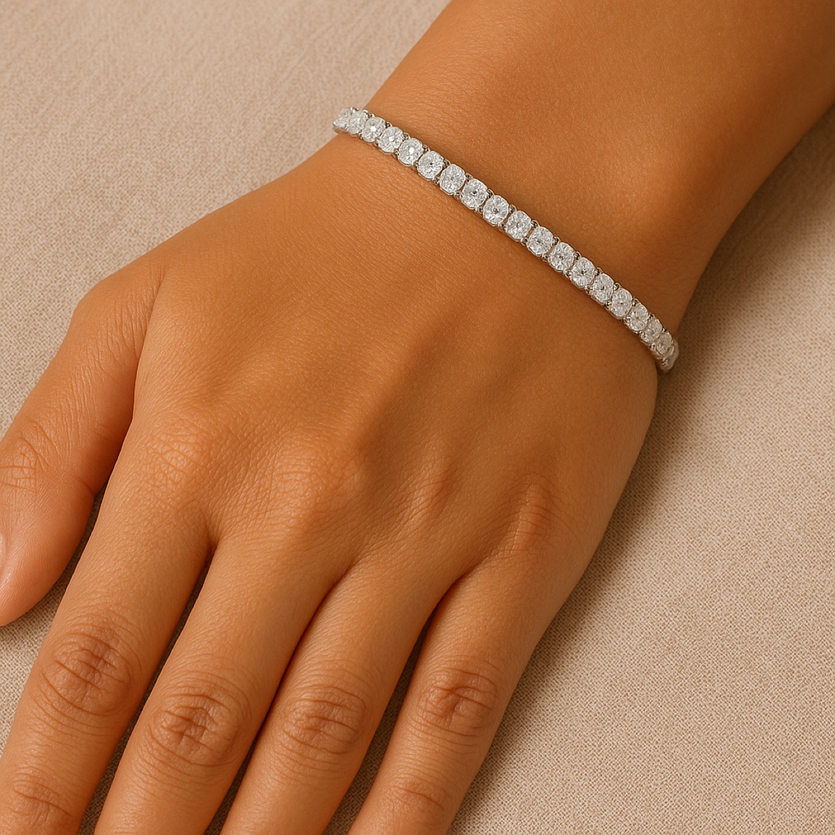 A diamond tennis bracelet of Ultra-Ideal cut stones in white gold, worn on the wrist